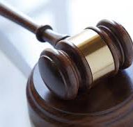 Gavel resting on atable